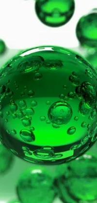 This stunning live wallpaper showcases a green glass ball on a table, adorned with water droplets, creating a dripping-soap-bubbles effect