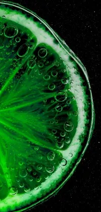 Enhance your phone's home screen with this stunning live wallpaper featuring a close-up of a vibrant lime slice