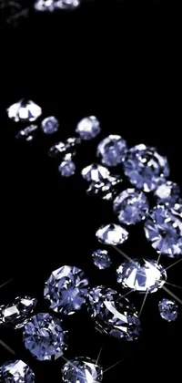 This phone live wallpaper features glistening diamonds on a black background, creating a striking and elegant look