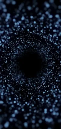 This digital live wallpaper features a striking black hole contrasted against a black background