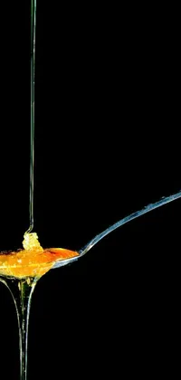 This live wallpaper showcases an incredible macro photograph of a spoon filled with food