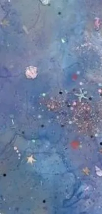 This phone live wallpaper features an intricate painting on a table, inspired by metaphysical art, and floating within a mesmerizing nebula under a sea of stars
