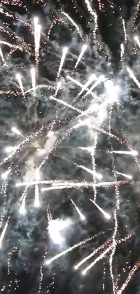 Enjoy a dazzling display of fireworks with this captivating live wallpaper for your phone