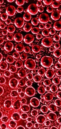 Get mesmerized by this phone live wallpaper featuring floating bubbles in rich red color and detailed textures
