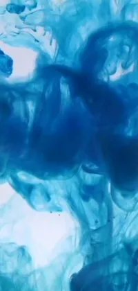 Discover a breathtaking live wallpaper for your phone featuring mesmerizing blue ink swirling artistically in water