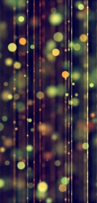 This phone live wallpaper features vibrant hanging lights in gold, green, and purple colors on a visually stunning background image