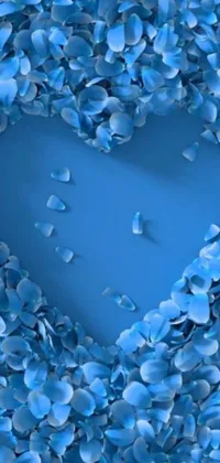Transform your phone's screen with this stunning live wallpaper featuring a captivating heart made of blue petals set against a tranquil blue backdrop