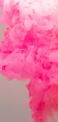 Make your phone background pop with the Pink Smoke Live Wallpaper, featuring a stunning cloud of swirling pink smoke