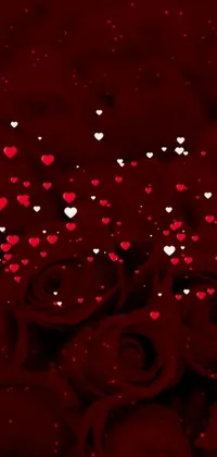This stunning phone live wallpaper showcases a bunch of red roses adorned with hearts, set against a deep red background