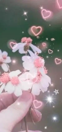 This phone live wallpaper features a bouquet of flowers held by a person against a backdrop of hearts