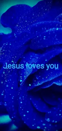 This stunning phone live wallpaper features a blue rose with the text "Jesus loves you", atop a deep and ethereal aesthetic backdrop