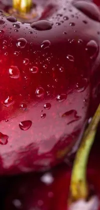 This stunning phone live wallpaper showcases a macro photograph of cherries with water droplets
