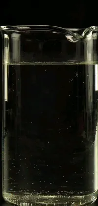 Enhance your phone's visual appeal with this stunning live wallpaper featuring a glass beaker filled with water