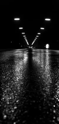 This 1024x1024 phone live wallpaper features a postminimalist photo of a wet night street in a classic black and white color scheme