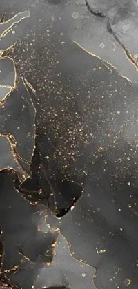 This phone live wallpaper features a close-up of a black and gold marble surface, with a generative art overlay of abstract shapes and patterns, creating a luxurious and unique feel