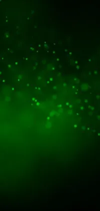 This phone live wallpaper showcases a captivating close-up of green lights against black background