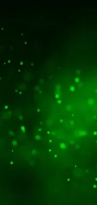 This phone live wallpaper features a stunning green light shining bright against a black background