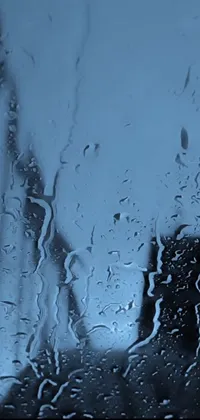 Bring the calming sound and sight of rain to your phone's home screen with this realistic live wallpaper