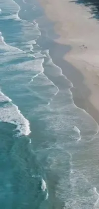 This live phone wallpaper features a serene beach scene on the emerald coast of South Africa