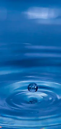 Experience the mesmerizing and realistic "Blue Water Drop" live wallpaper on your phone