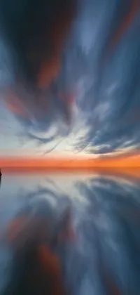 Get lost in a stunning live wallpaper featuring a captivating body of water reflecting a breathtaking sunset