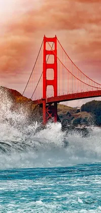 Transform your phone's plain background into a breathtaking live wallpaper featuring a vast body of water with towering waves and a majestic bridge, all presented in an image by a well-known photographer