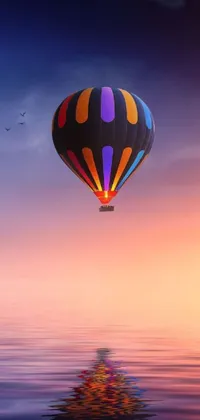 This live wallpaper features a beautifully detailed hot air balloon flying over a serene body of water