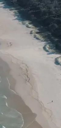This live wallpaper showcases a beautiful aerial view of a coastal scene on the emerald coast