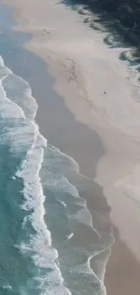 This impressive live phone wallpaper takes you to the South African coast with its picturesque sandy beach and vast body of water
