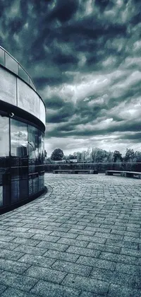 This black and white live wallpaper features a stunning photograph of a building against a cloudy backdrop, with an Instagram-like filter for a vintage look