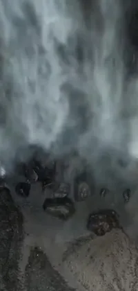 This phone live wallpaper features a compelling variety of scenes, including a close-up of a smoking fire hydrant, a Reddit or video art-inspired image, immersion in a flowing waterfall, a drone's eye view, a shot from Jurassic World (2015) and a shot from beloved show Game of Thrones