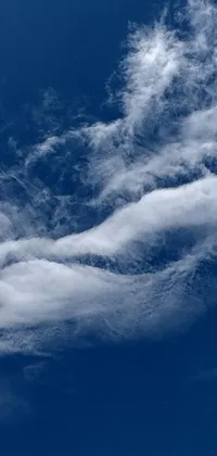 This live wallpaper features a massive jetliner soaring through a clear blue sky surrounded by ceremonial clouds