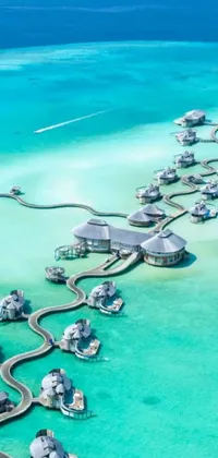 This live wallpaper showcases an aerial view of a resort in the middle of the ocean