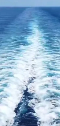 Ocean boat live wallpaper for phones featuring a stunning view of the ocean from the back of a boat