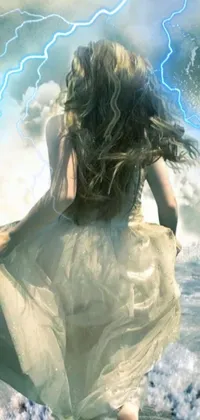 Looking for a stunning live wallpaper for your phone? This one features a breathtaking fantasy scene, complete with a woman standing in the water amidst a stormy sky