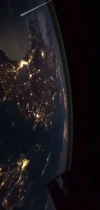 Experience the awe-inspiring beauty of Earth from space with this incredible live wallpaper! Featuring stunning footage of our planet at nighttime, captured from the International Space Station, this wallpaper offers a mesmerizing and captivating view of our world