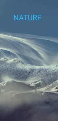 This phone live wallpaper shows a snowboarder gliding down a snow-covered mountain with wind blowing and hair flowing