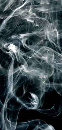 This phone live wallpaper features mesmerizing digital art of smoking vessels with a close-up view of smoke rising on a black background