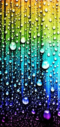 Add a playful pop of color to your phone with this lively live wallpaper! Set against a brilliant rainbow background, delicate blue and green water droplets create a playful, energizing effect