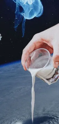 This phone live wallpaper showcases the close-up pouring of milk into a cup