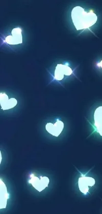 This lovely phone live wallpaper features floating pink hearts with blue shiny lighting that creates a beautiful visual effect