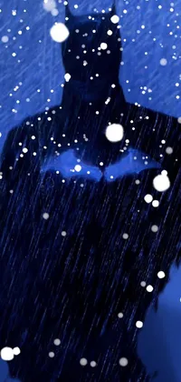 This live wallpaper depicts a character in a Batman suit facing a heavy rainstorm
