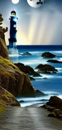 This phone wallpaper features a stunning scene of a lighthouse perched atop a cliff overlooking the ocean