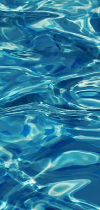 This phone live wallpaper depicts a stunning close up of water in a swimming pool, achieved through digital rendering