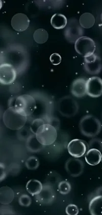 This stunning live phone wallpaper features a collection of bubbles floating in the air against a dark, smoky background