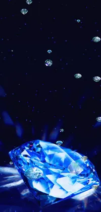 This stunning live wallpaper features a mesmerizing blue diamond sitting on top of a table, with crystal cubism creating a modern and abstract appearance
