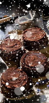 This enticing phone live wallpaper features delectable brownies topped with luscious chocolate frosting on a circular table