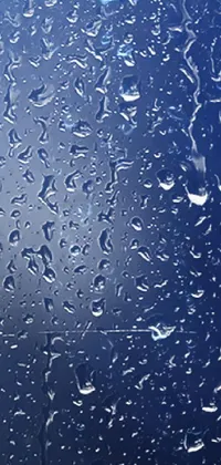 Experience the serenity of a rainy day with this stunning phone live wallpaper