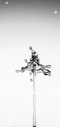 This live wallpaper features a black and white photograph of a water drop, combined with an ink drawing