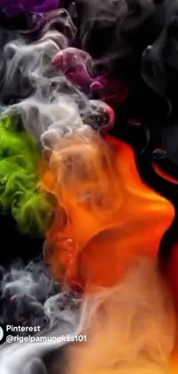 Witness the unparalleled beauty of this phone live wallpaper, featuring a stunning close-up view of colored smoke against a black backdrop